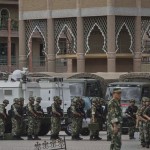 Chinese soldiers in front of the Id Kah Mosque, in Kashgar, on Thursday. China has increased security in many parts of Xinjiang. Getty Images